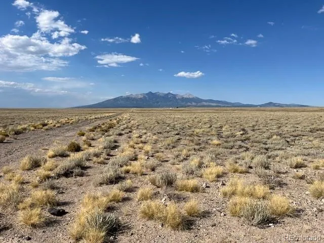a view of an ocean and a mountain