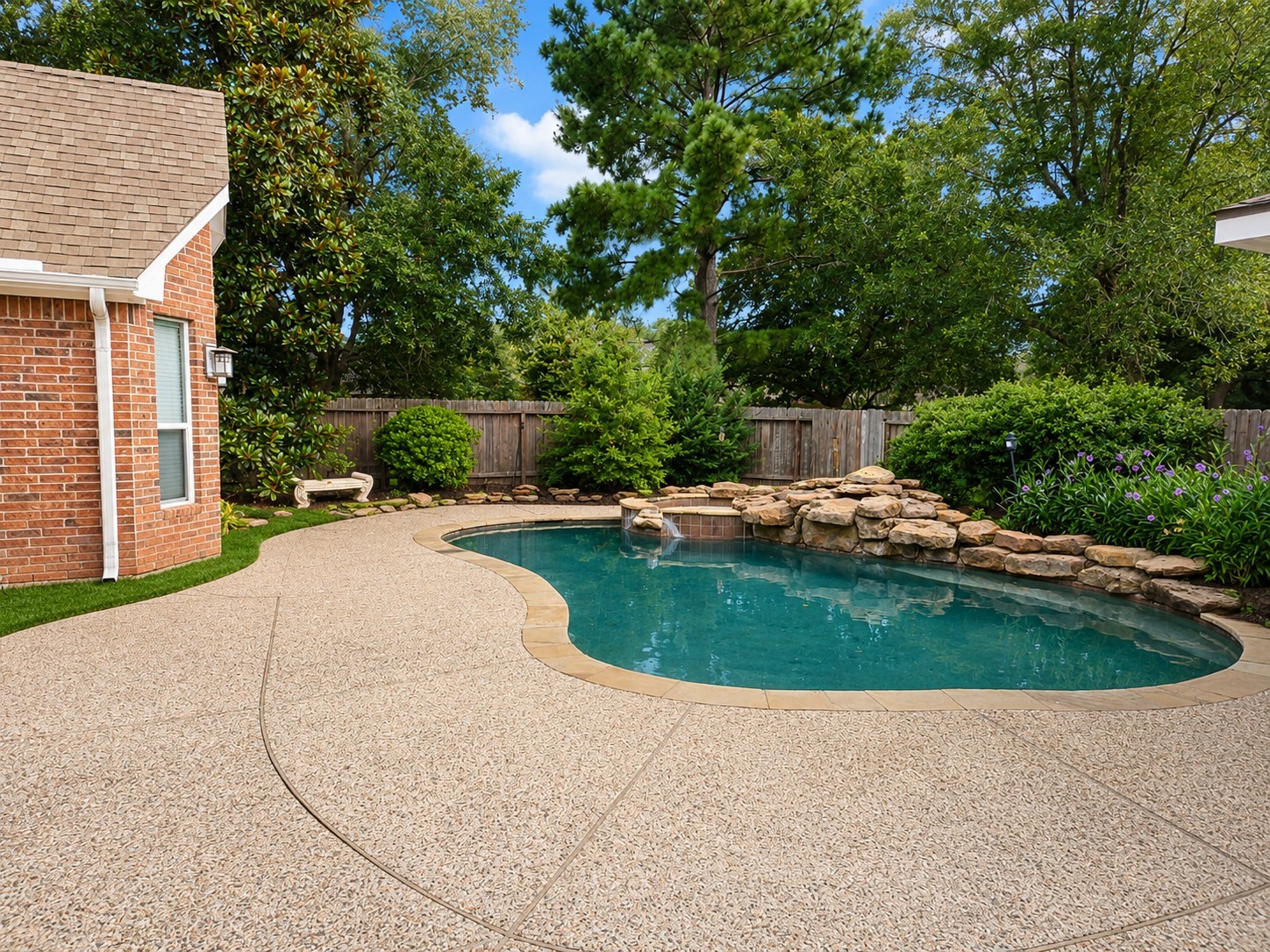20203 Timberstone Lane Spring, TX 77379 - Photo 20 of 23 This is the true centerpiece—your private backyard oasis. The pool and spa, along with water features, create a resort-style setting ideal for Houston summers.