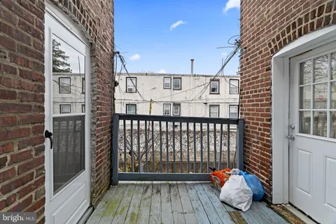 a balcony view with a wooden floor