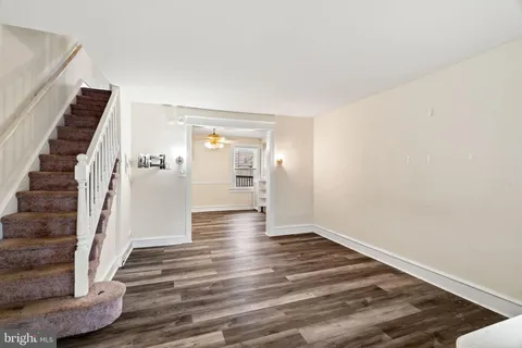 a view of an entryway with wooden floor