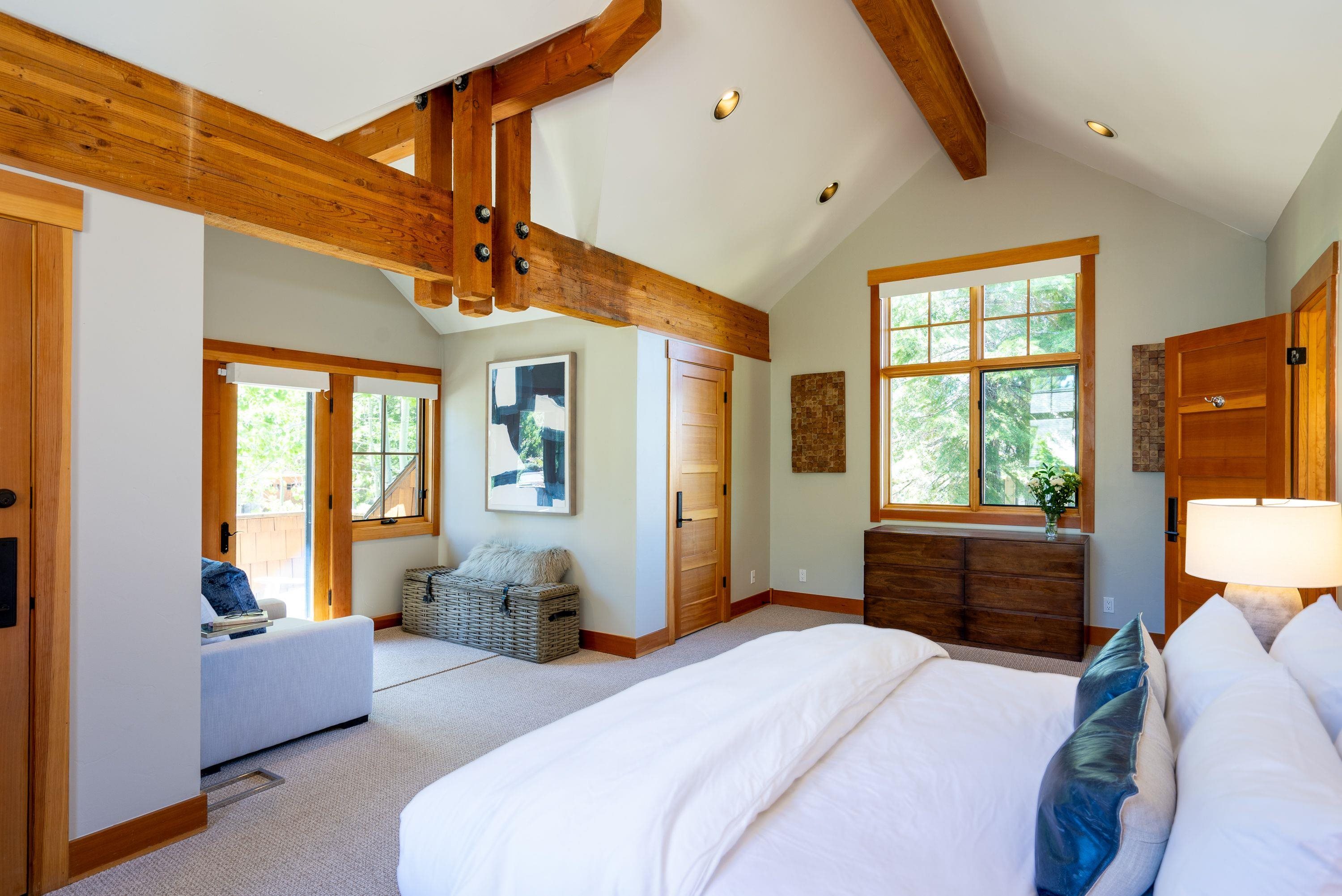 1723 Grouse Ridge Road Truckee, CA 96161 - Photo 14 of 27 a bedroom with a bed couch and large windows
