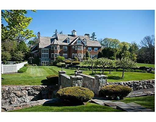 548 Stanwich Road Greenwich, CT 06831 - Photo 1 of 20 a view of a house with a yard and potted plants