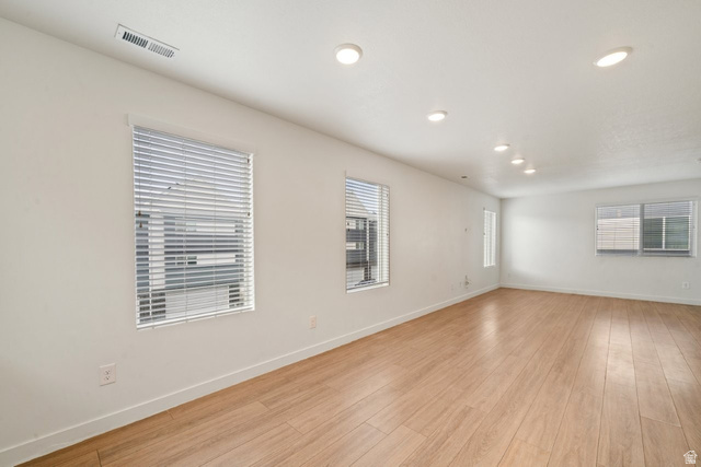 70 East Weekes Way Clearfield, UT 84015 - Photo 7 of 25 Empty room with light wood-type flooring and recessed lighting