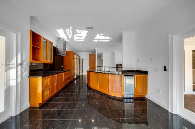 a view of kitchen with cabinets and outdoor view