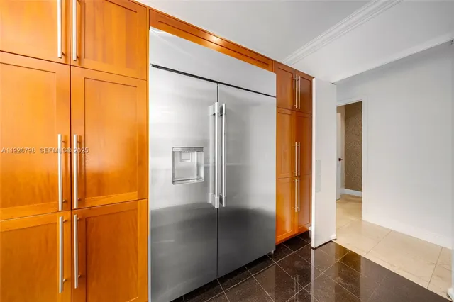 a living room with stainless steel appliances kitchen island granite countertop furniture and a large window