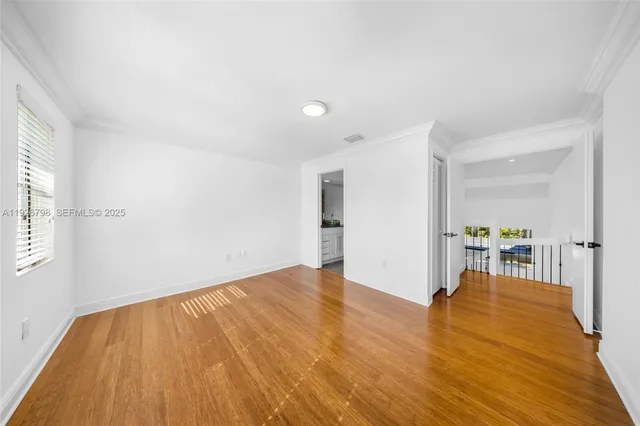 a kitchen with a granite countertop sink and cabinets