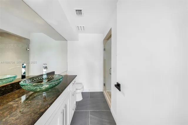 a view of an empty room with sliding glass door