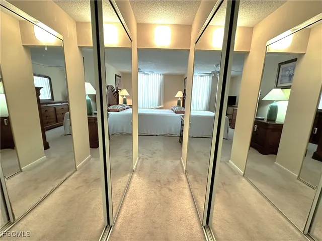 a spacious bedroom with a bed and a couch