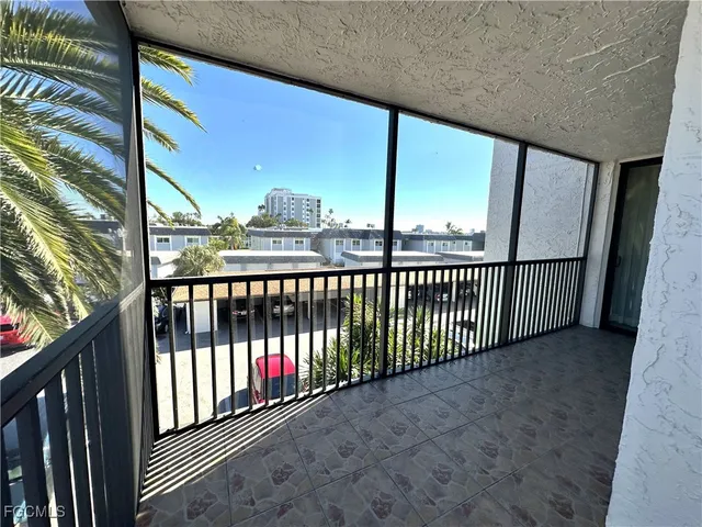 a view of street and car parked