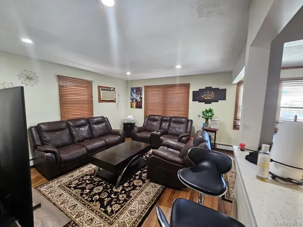 a living room with furniture and a rug