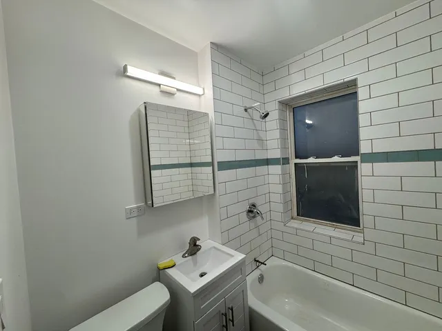 a bathroom with a sink and mirror