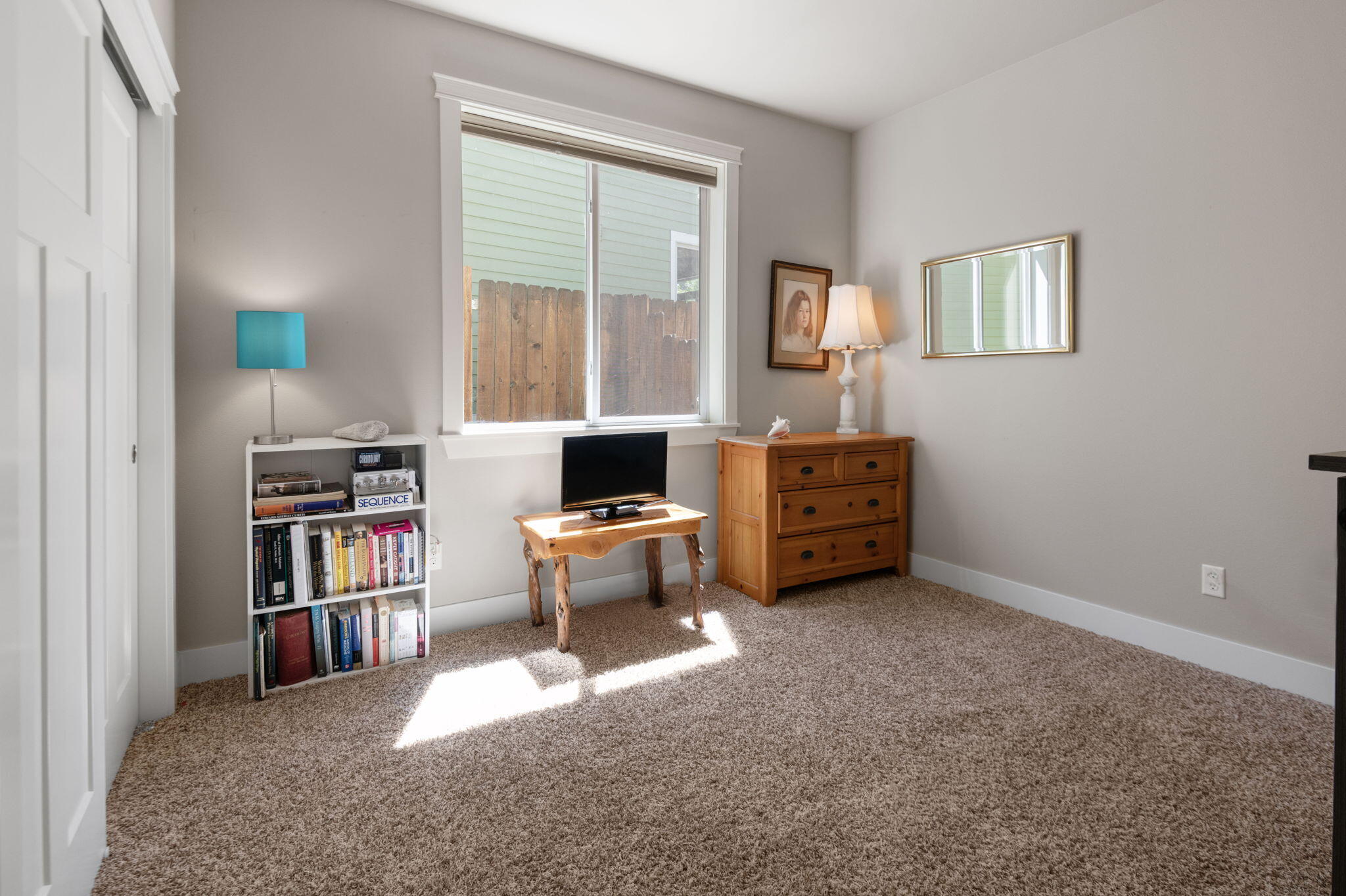 62944 Fresca Street Bend, OR 97703 - Photo 11 of 32 a view of a workspace with furniture and a window