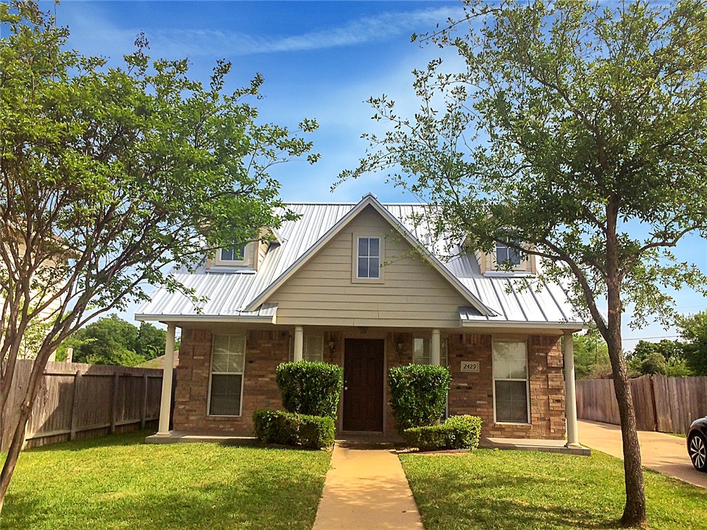 front view of a house with a yard