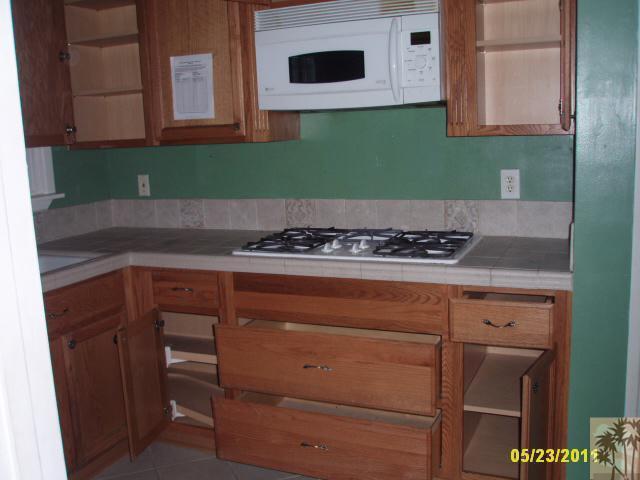 3595 Verde Street Riverside, CA 92504 - Photo 5 of 9 a kitchen with a cabinets and a stove top oven
