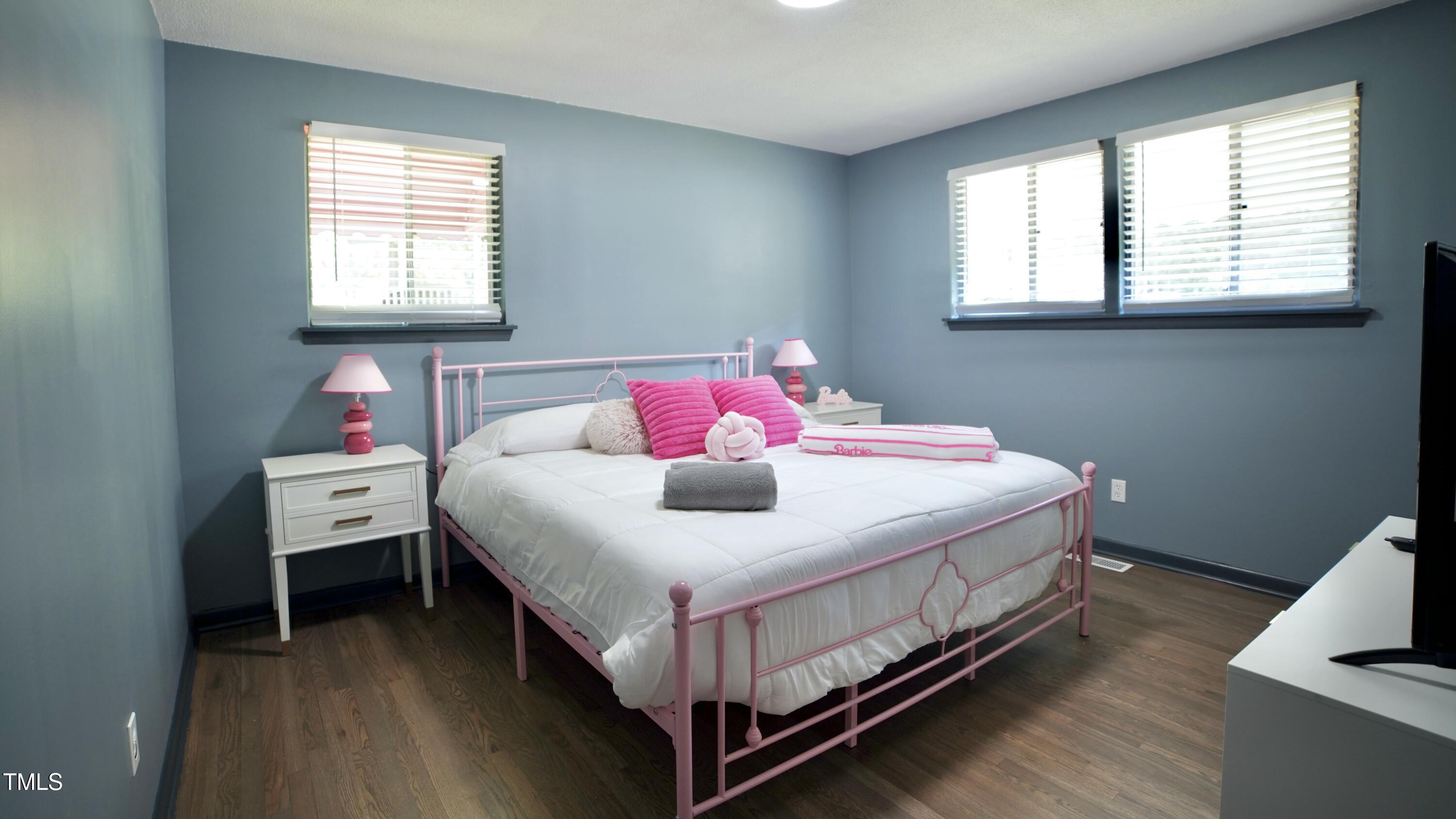 2006 Waters Drive Raleigh, NC 27610 - Photo 14 of 16 a bedroom with a bed and a window