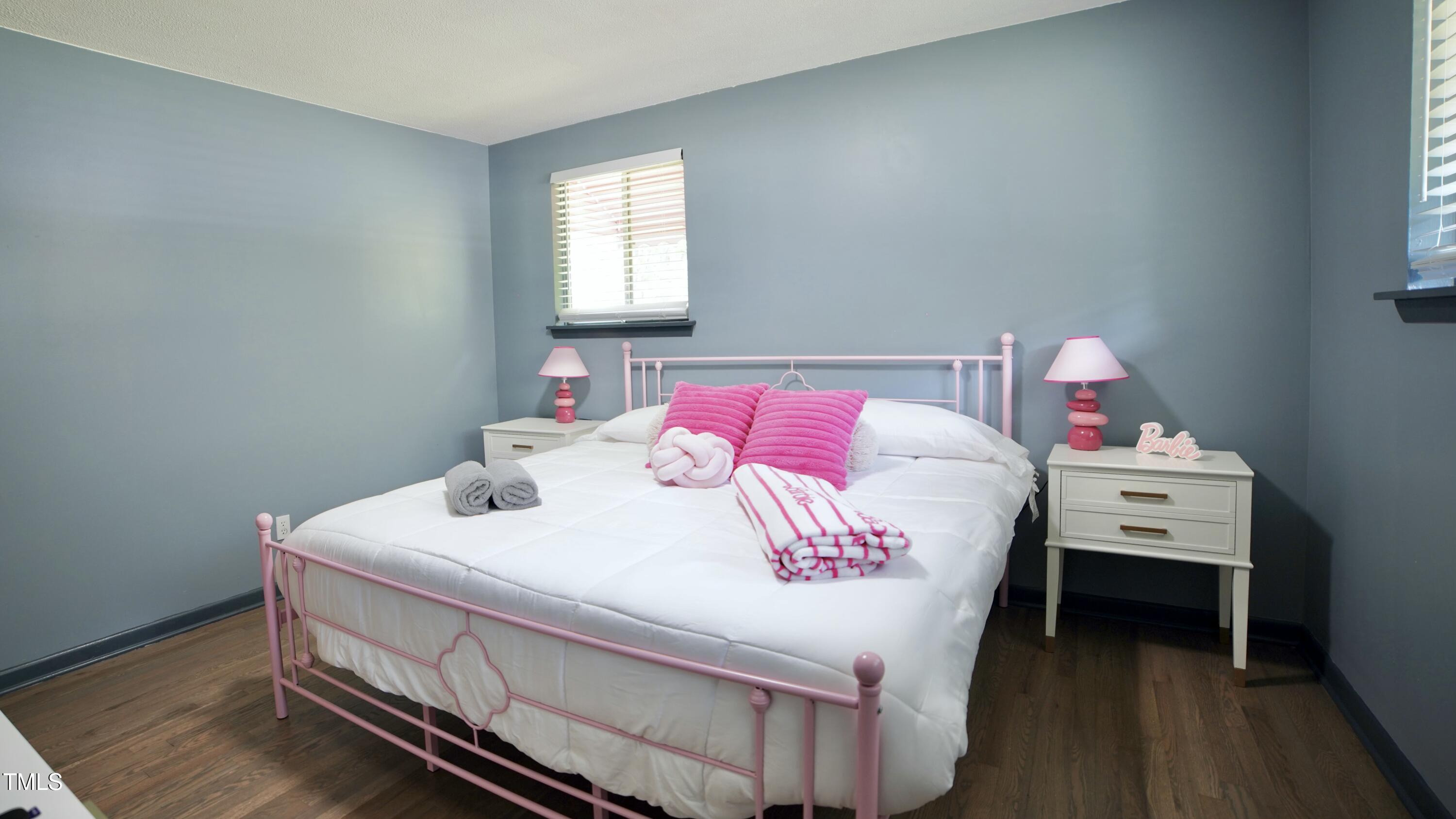2006 Waters Drive Raleigh, NC 27610 - Photo 15 of 16 a bedroom with a bed and a window