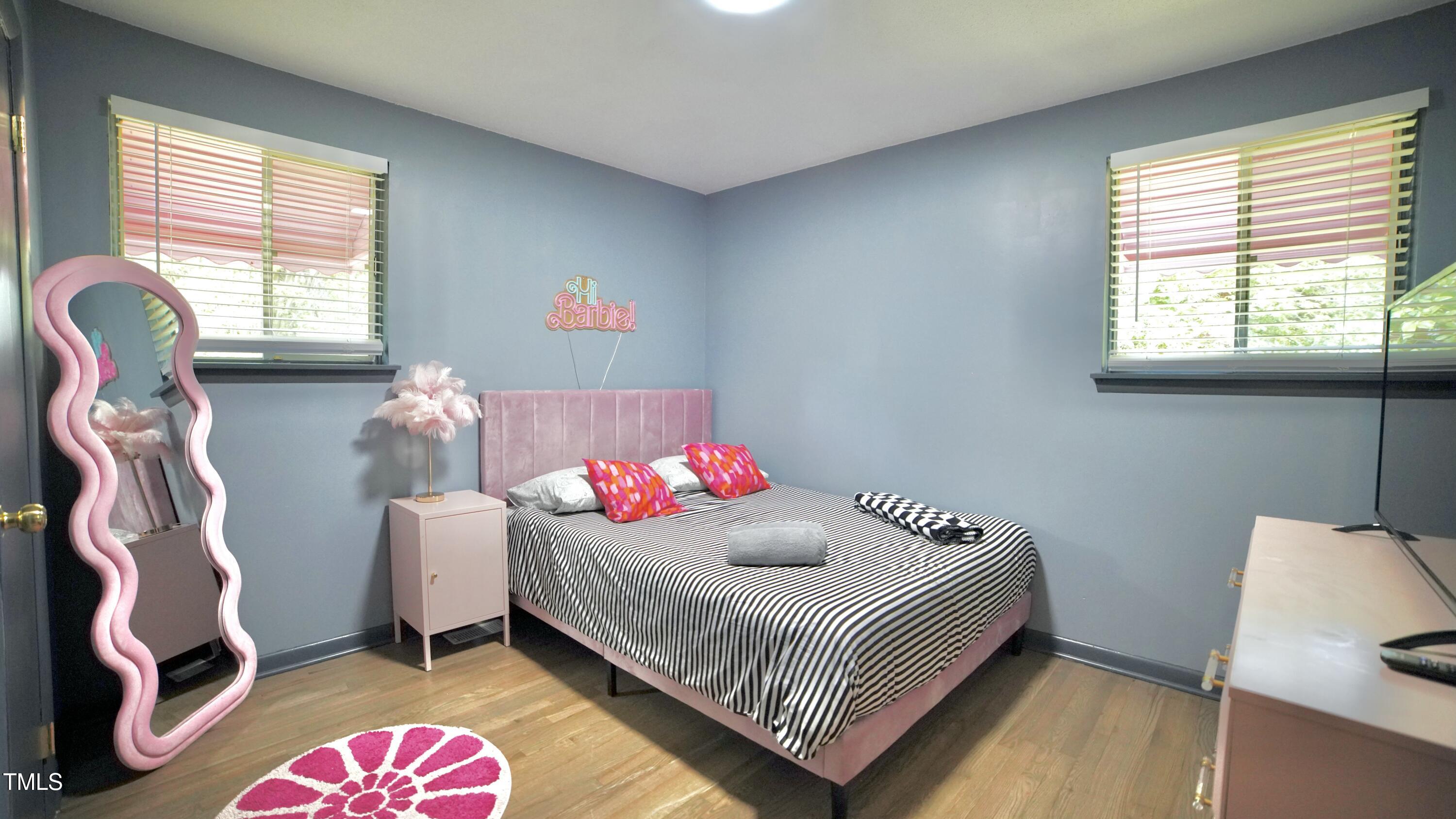 2006 Waters Drive Raleigh, NC 27610 - Photo 16 of 16 a bedroom with a bed and a window