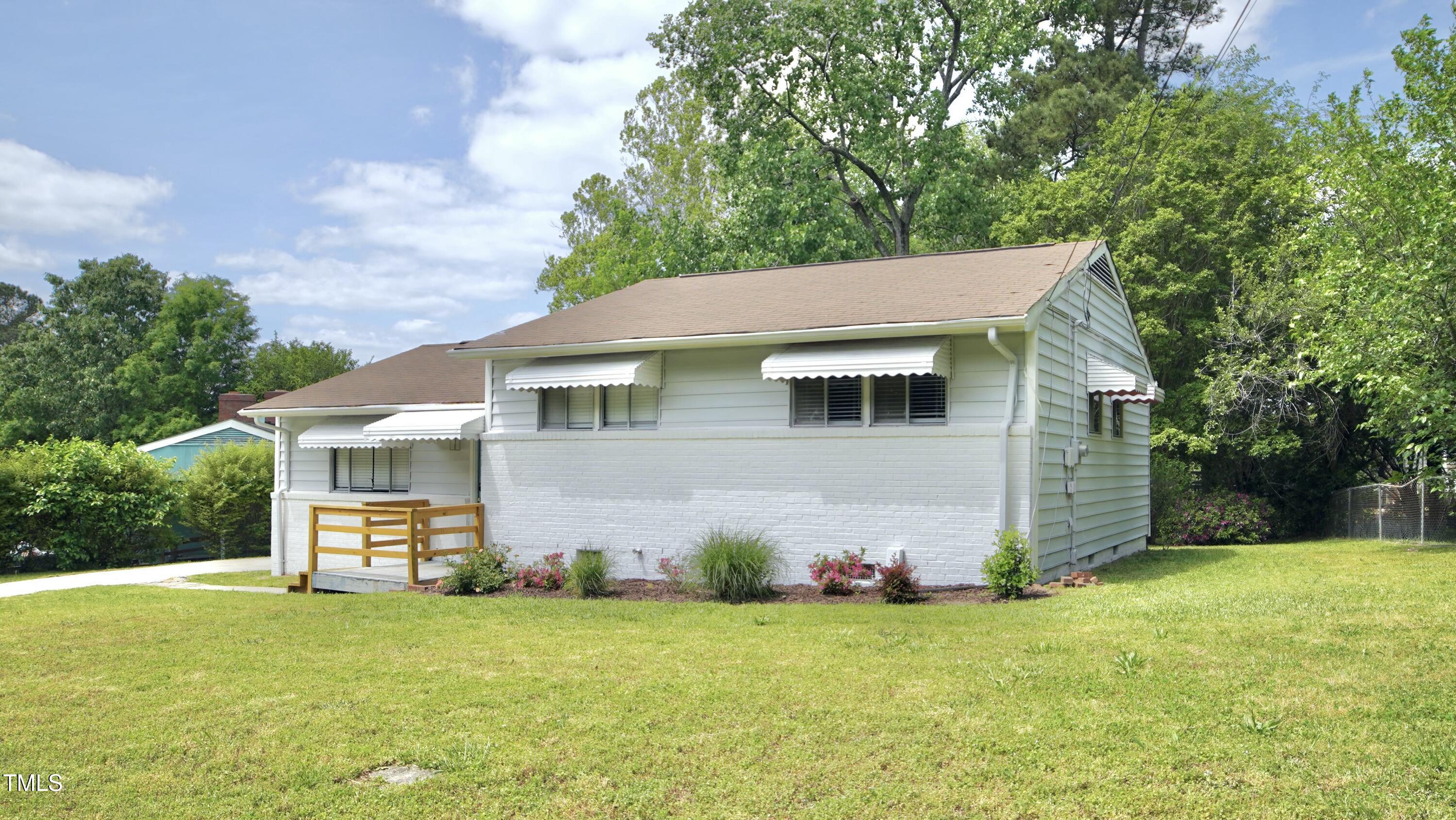 2006 Waters Drive Raleigh, NC 27610 - Photo 2 of 16 a view of a house with backyard and garden