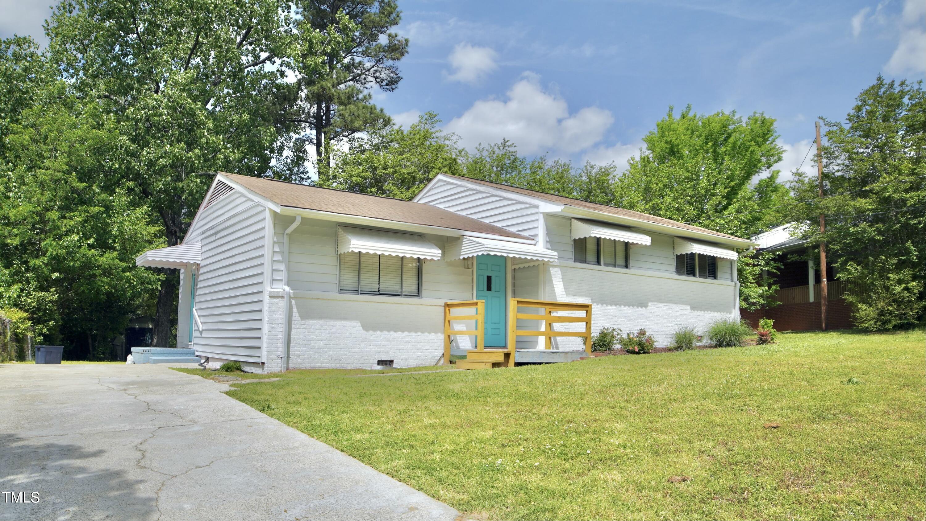 2006 Waters Drive Raleigh, NC 27610 - Photo 3 of 16 a front view of house with yard and green space
