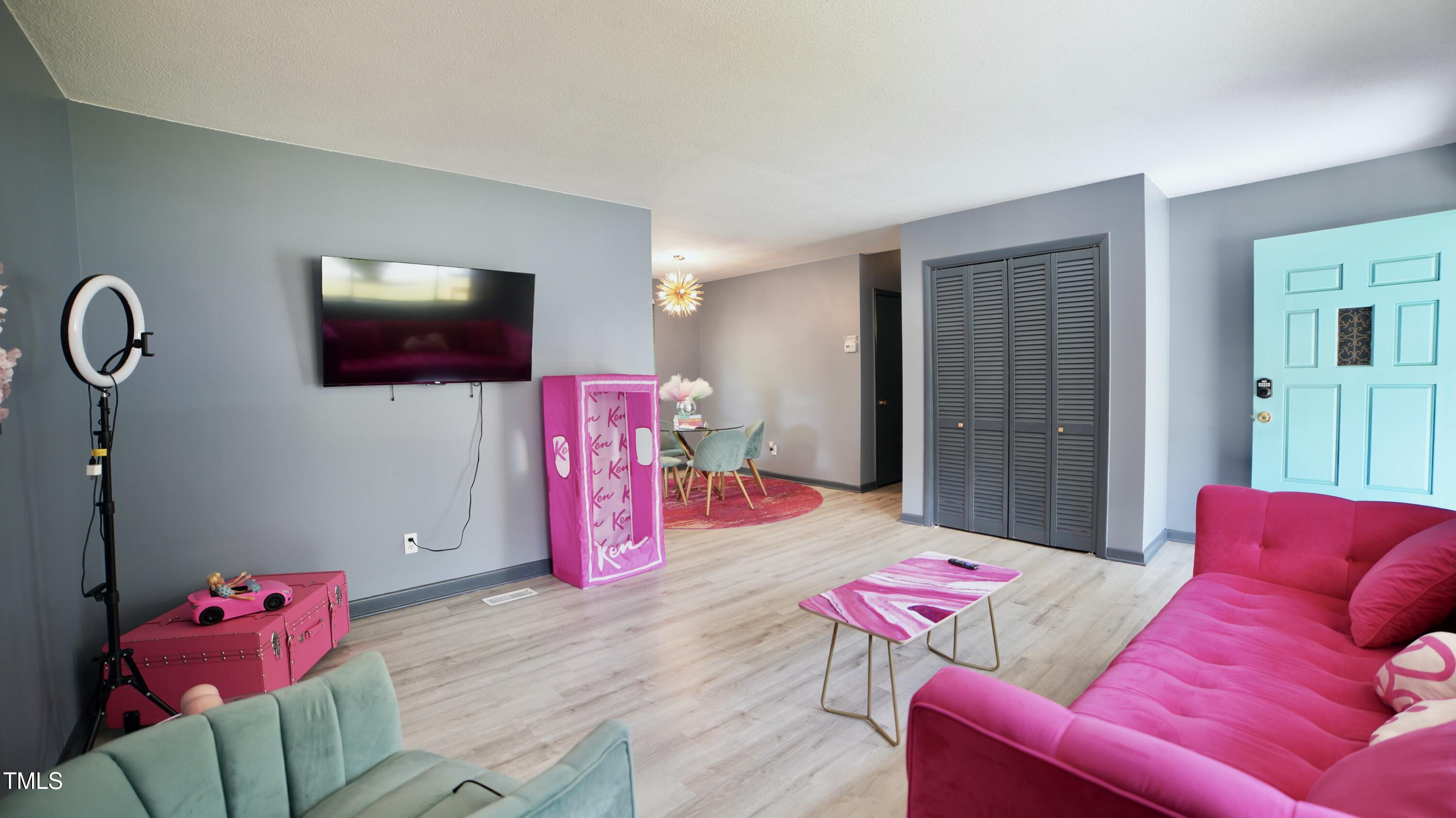 2006 Waters Drive Raleigh, NC 27610 - Photo 5 of 16 a living room with furniture and a flat screen tv