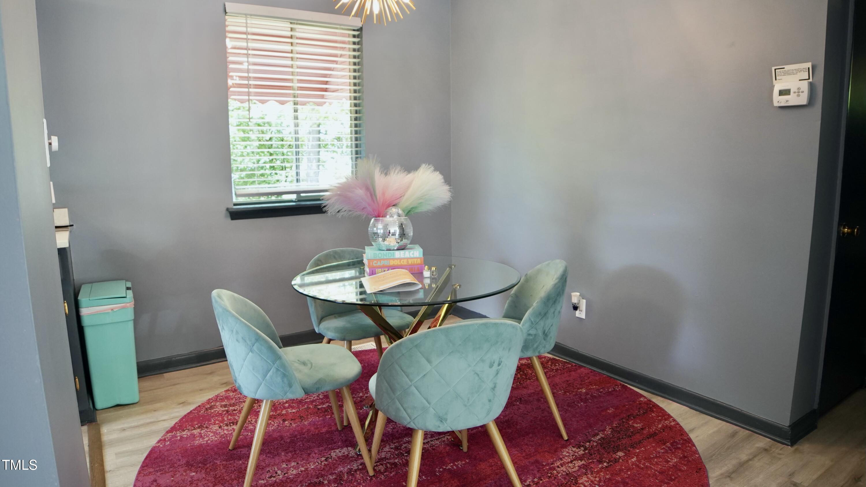 2006 Waters Drive Raleigh, NC 27610 - Photo 6 of 16 a view of a dining room with furniture and wooden floor