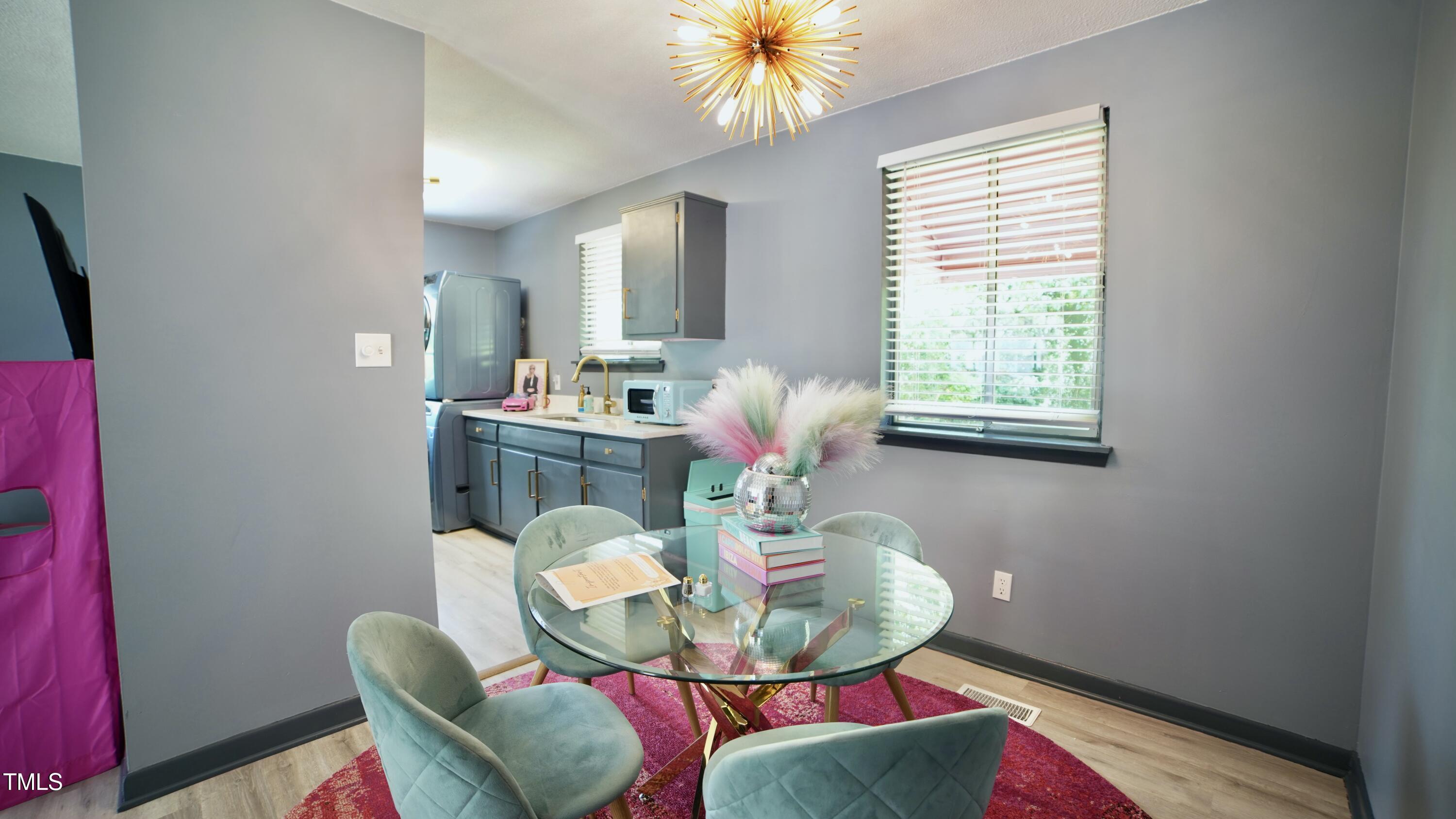 2006 Waters Drive Raleigh, NC 27610 - Photo 7 of 16 a living room with furniture and a potted plant