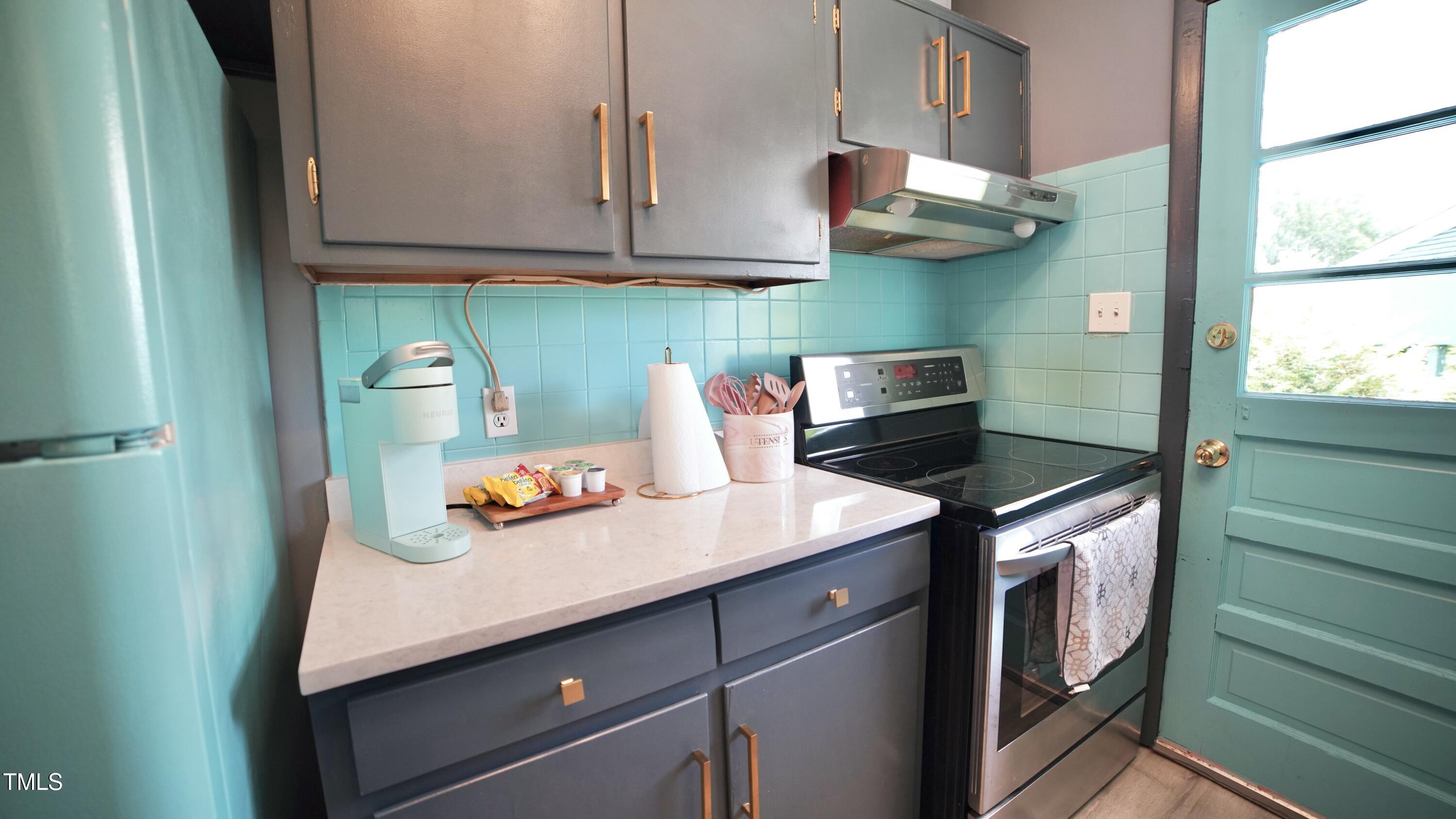 2006 Waters Drive Raleigh, NC 27610 - Photo 9 of 16 a kitchen with stainless steel appliances granite countertop a sink and a stove
