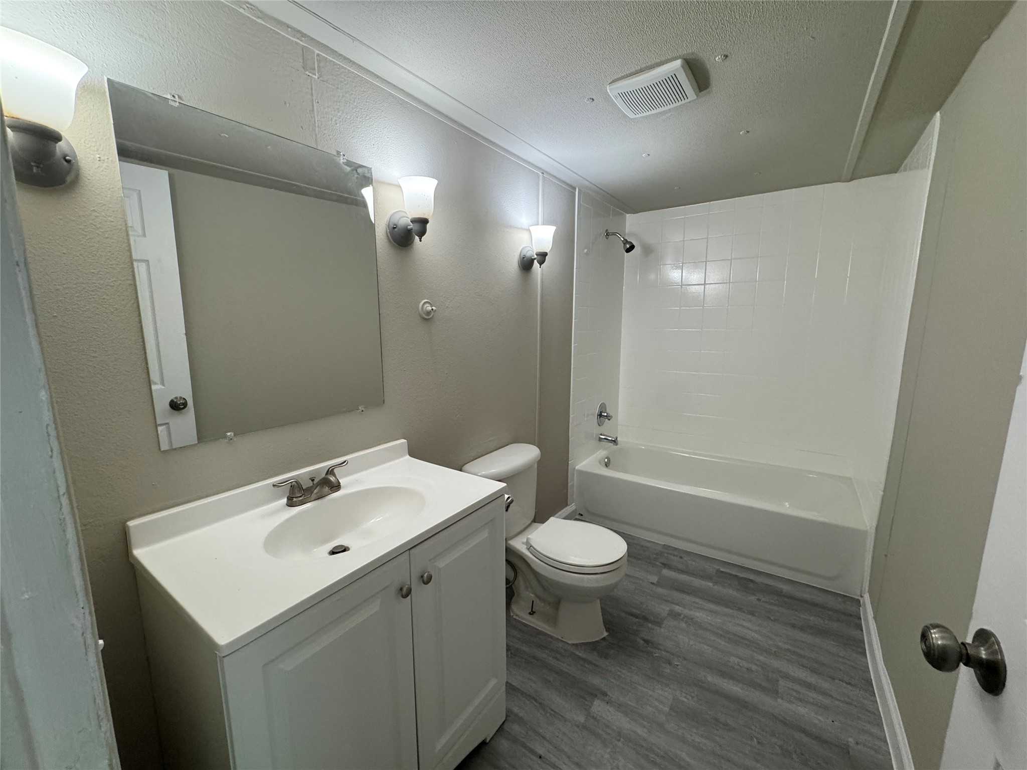 6226 County Road 48 Rosharon, TX 77583 - Photo 6 of 11 a bathroom with a sink toilet a mirror and shower