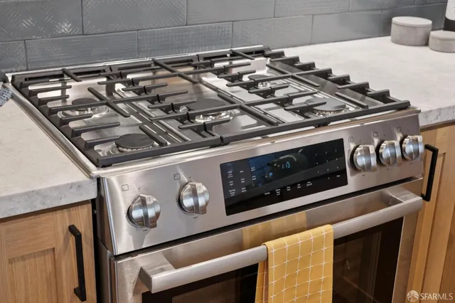 a close up of a stove top oven sitting inside of a kitchen