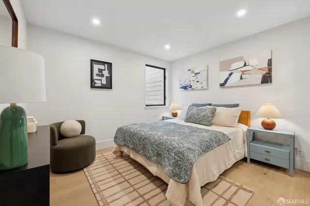 a bedroom with bed and window