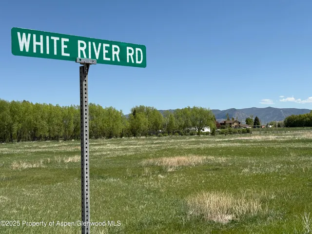 a view of a street with an outdoor space