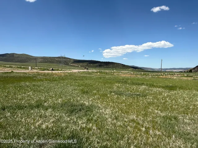 a view of an ocean and a mountain