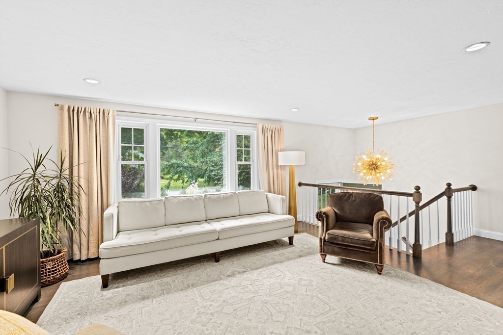 40 Brewster Road Cohasset, MA 02025 - Photo 16 of 42 a living room with furniture and a potted plant on table