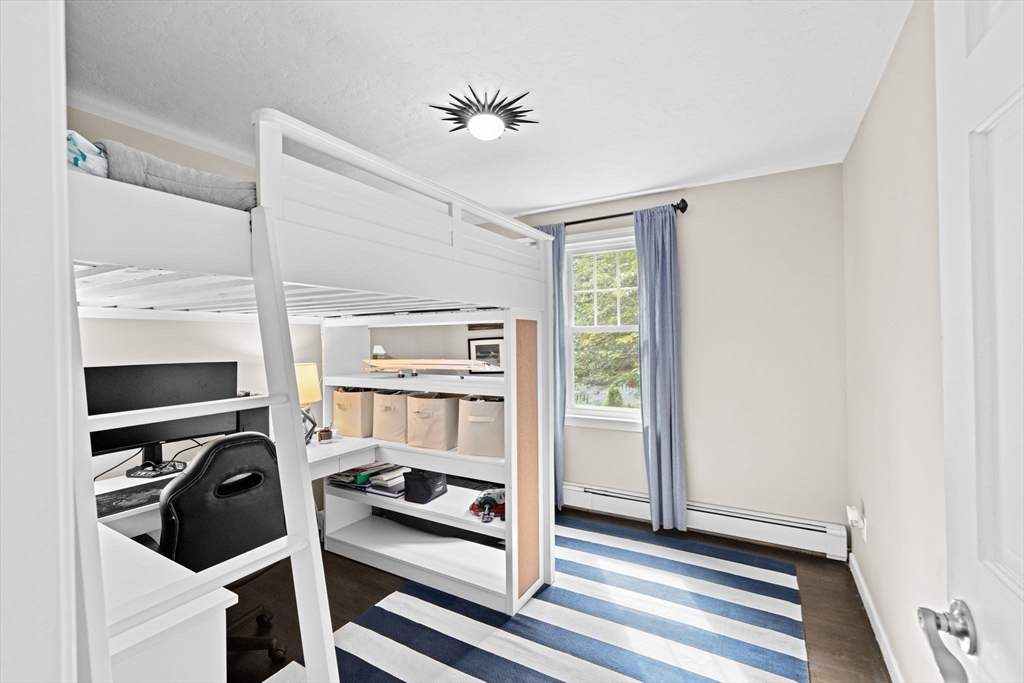 40 Brewster Road Cohasset, MA 02025 - Photo 22 of 42 a view of walk in closet with clothes and shoes