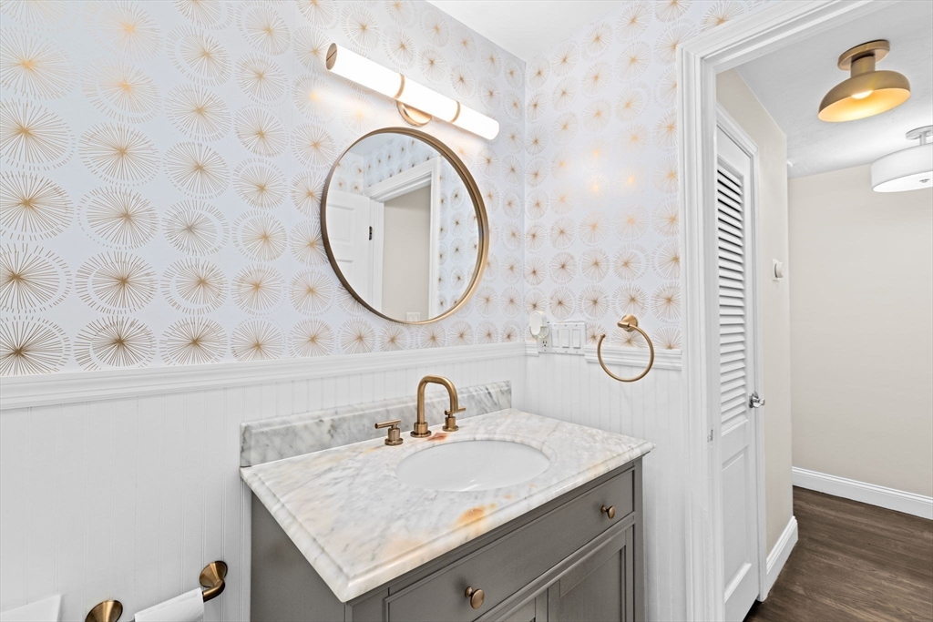 40 Brewster Road Cohasset, MA 02025 - Photo 24 of 42 a bathroom with a sink and a mirror