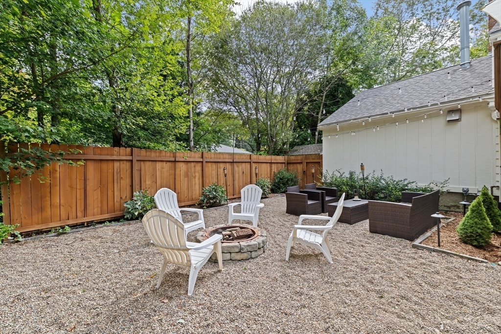 40 Brewster Road Cohasset, MA 02025 - Photo 38 of 42 a view of backyard with seating space and trees