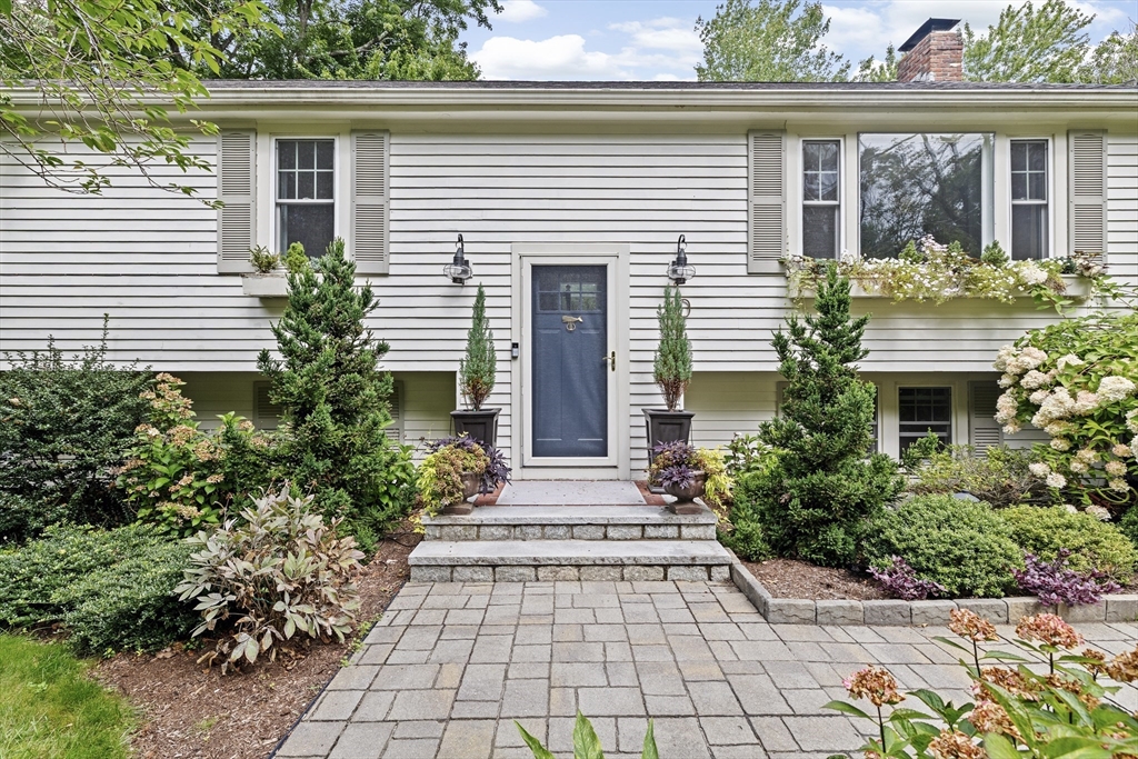 40 Brewster Road Cohasset, MA 02025 - Photo 42 of 42 a front view of a house with garden