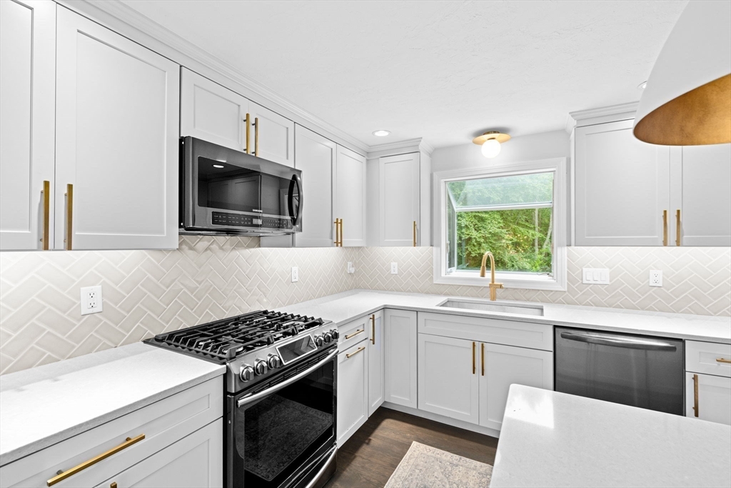 40 Brewster Road Cohasset, MA 02025 - Photo 6 of 42 a kitchen with a stove and a sink