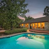 a front view of house with yard and outdoor seating