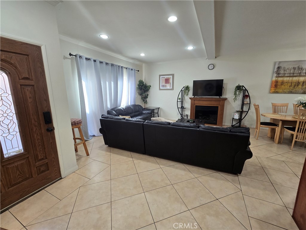 8026 Telegraph Road Downey, CA 90240 - Photo 5 of 26 a kitchen with stainless steel appliances a refrigerator and a stove top oven