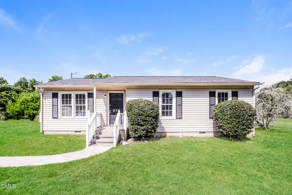 front view of a house with a yard