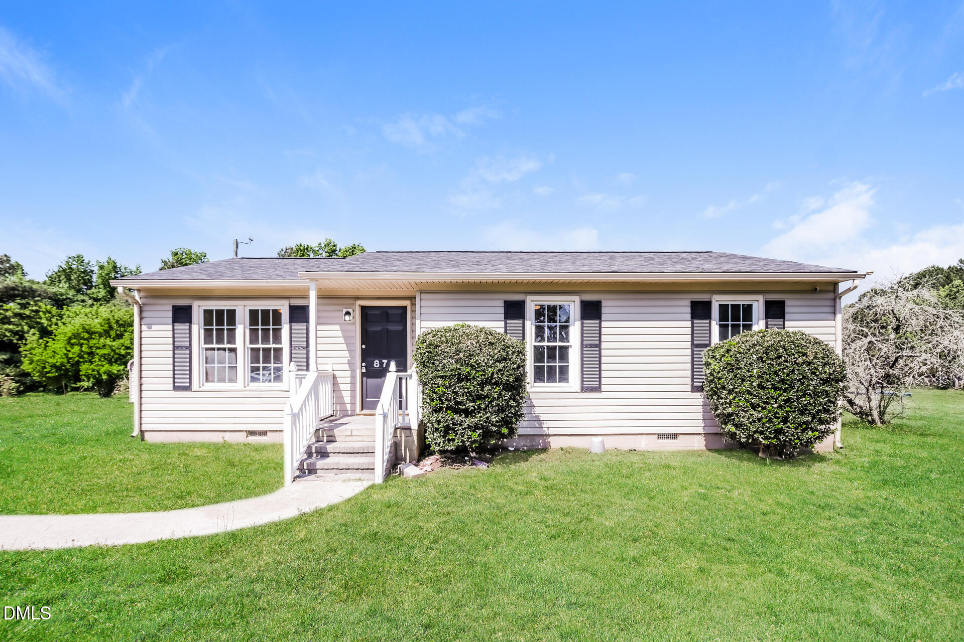 front view of a house with a yard