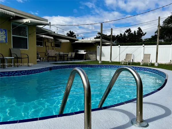 a view of swimming pool from a balcony