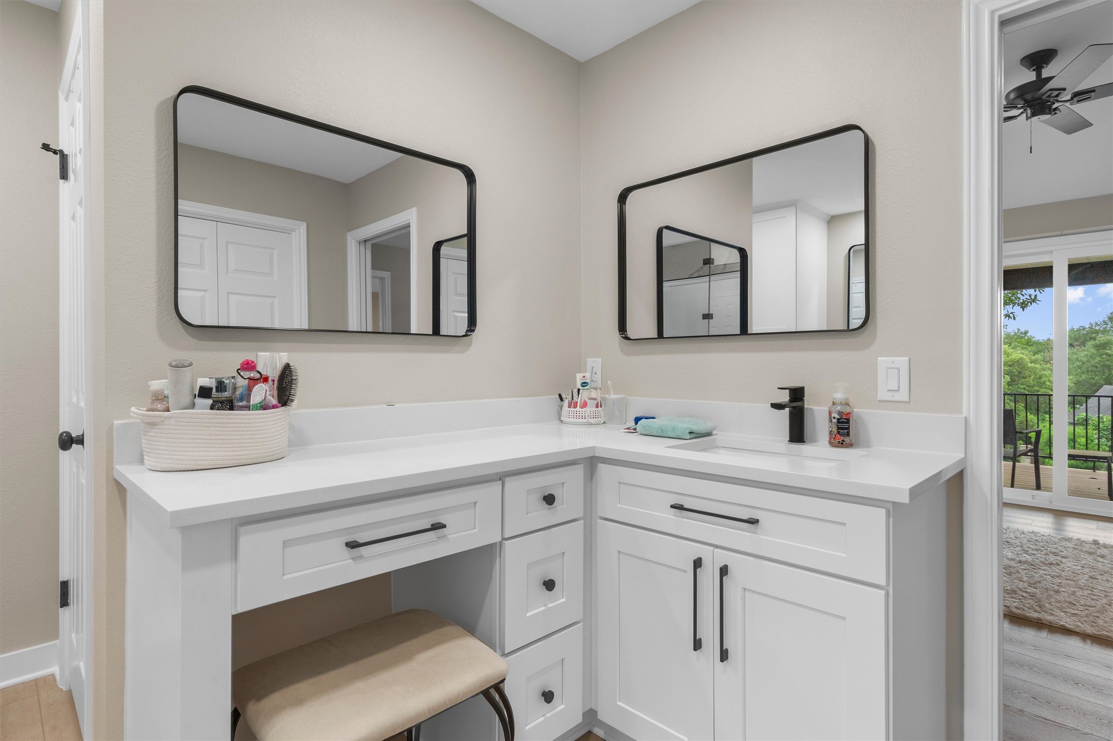 307 Hurst Creek Road Austin, TX 78734 - Photo 30 of 40 Bathroom vanity with white cabinetry, matte black hardware, and an integrated sink with a matte black faucet