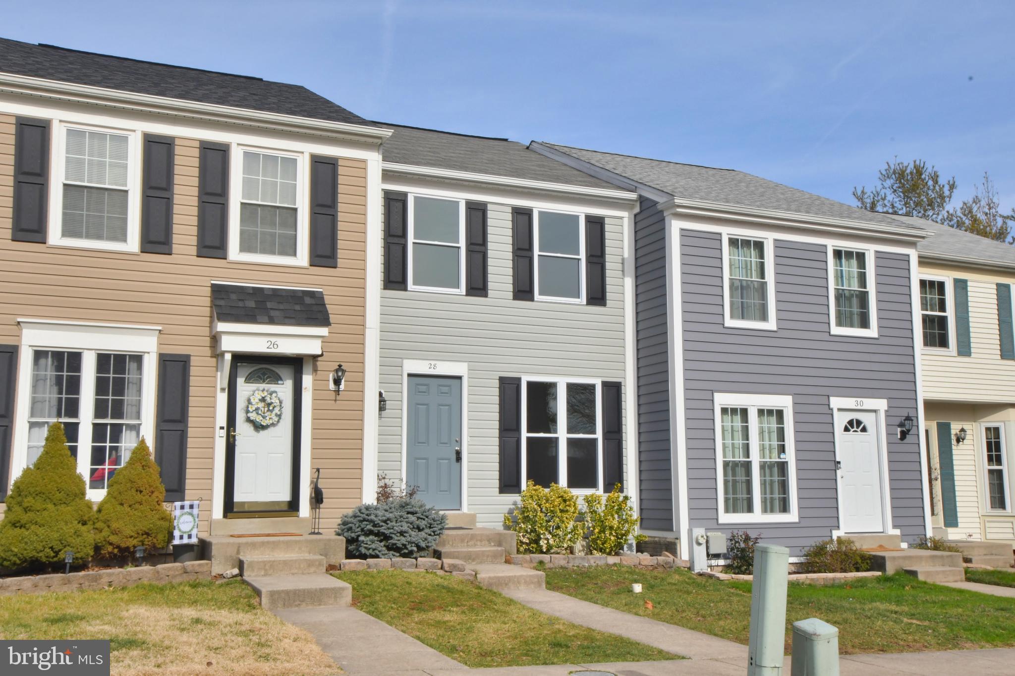 28 Pine Chip Court Baltimore, MD 21236 - Photo 1 of 32 front view of a brick house with a yard