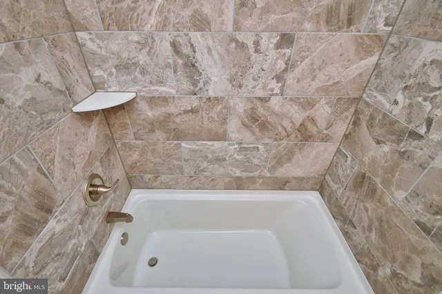 a bathroom with a bathtub