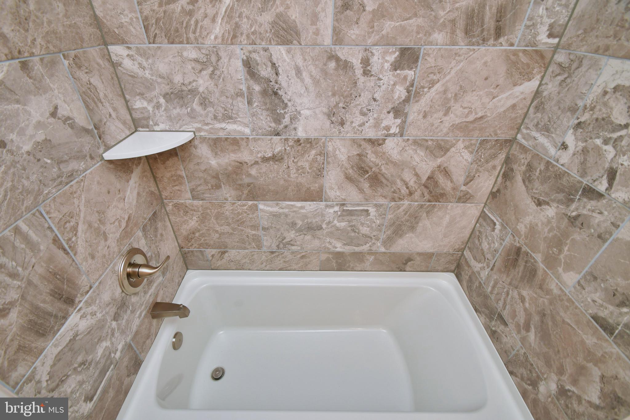 28 Pine Chip Court Baltimore, MD 21236 - Photo 19 of 32 a bathroom with a bathtub