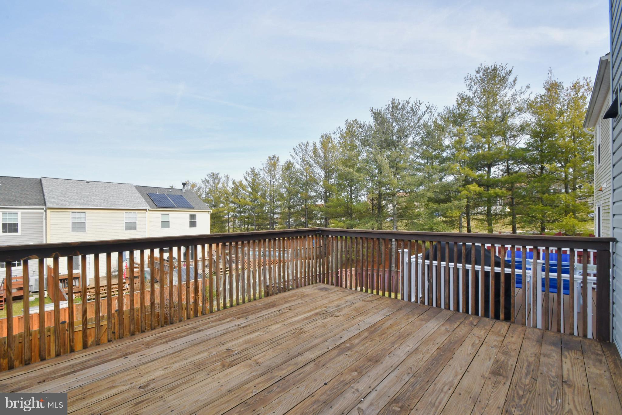 28 Pine Chip Court Baltimore, MD 21236 - Photo 5 of 32 a balcony with wooden floor and fence