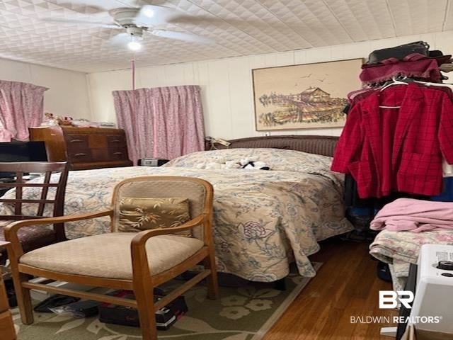 2359 Demetropolis Road Mobile, AL 36693 - Photo 6 of 8 Bedroom featuring wood-type flooring and a ceiling fan