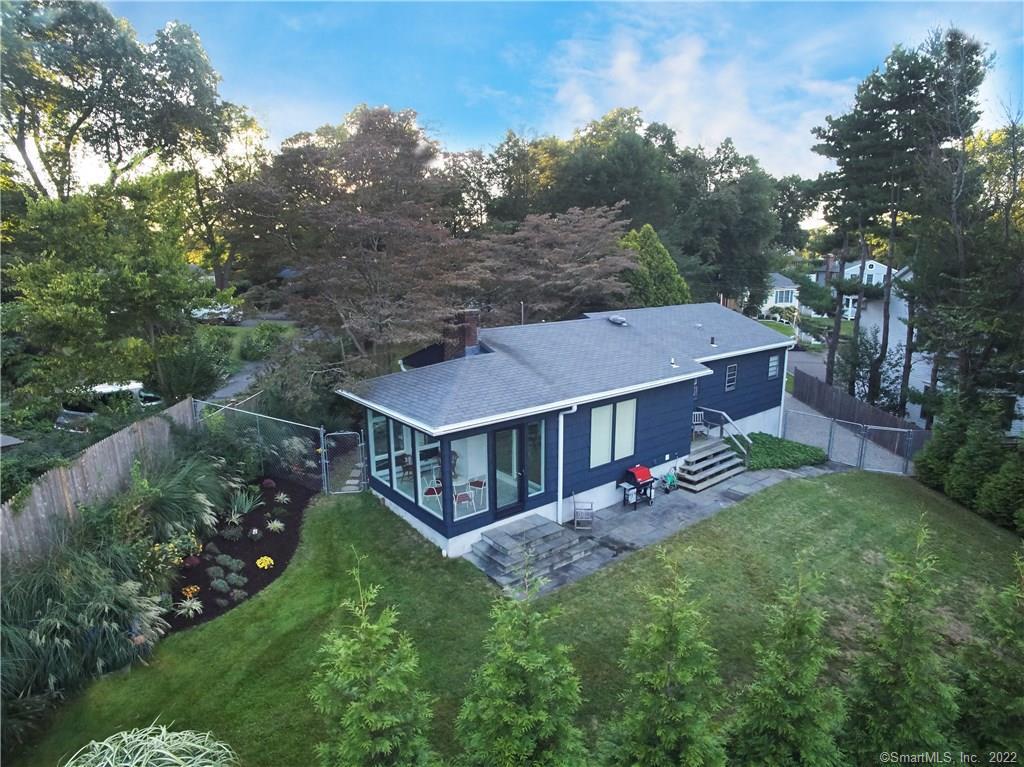 Welcome to 7 Drumlin! Bird's eye view flying west, from Mill Pond, over the rear garden, sunroom...